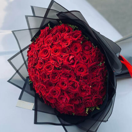 red roses in black paper